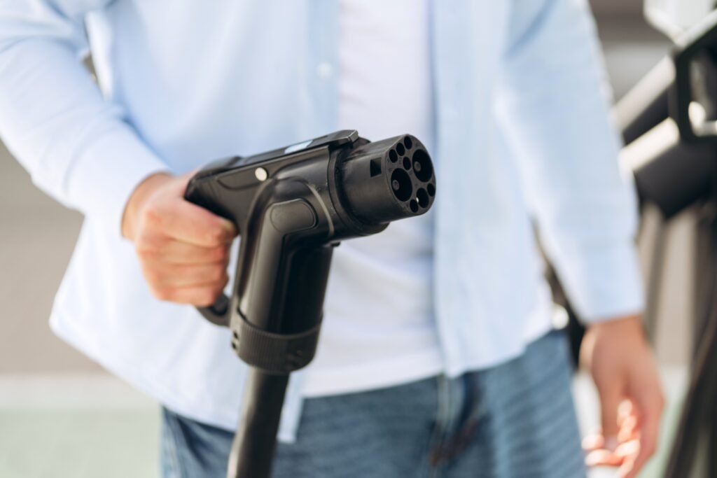 Man holding charging cable